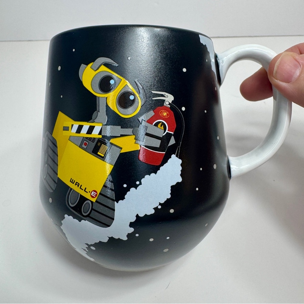 NWT. Disney mug featuring the characters WALL-E and E.V.E. Ceramic Disney mug
